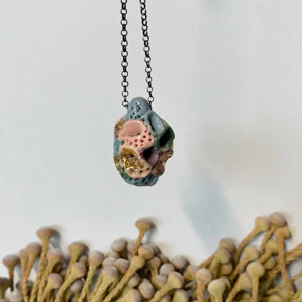 Coloured ‘rock coral’ pod pendant on oxidised sterling silver chain