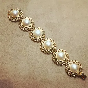 Yves Saint Laurent golden floral pearl bracelet